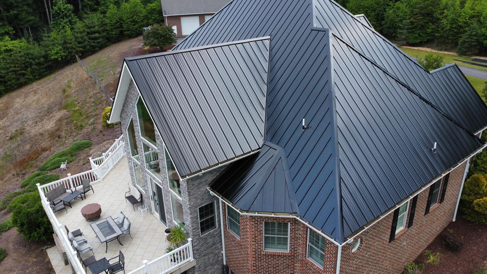 after new black metal roof installed asheboro